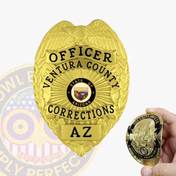 A custom flex badge in a bright gold color shaped like a traditional shield, representing the Ventura County Corrections. The badge prominently displays "OFFICER" at the top, followed by "VENTURA COUNTY," "CORRECTIONS," and "AZ" at the bottom. In the center is the state seal of Arizona. This badge features a velcro attachment on the back for secure and easy wear, making it ideal for correctional officers. A smaller security badge is held in a hand in the foreground, showcasing its design and utility.