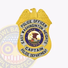 Police officer badge for east washington heights featuring a gold shield with a raised eagle design at the top, silver arced banners with bold black text naming the rank as “captain” and department details, surrounding the colorful illinois state seal, fixed with a metal safety pin.