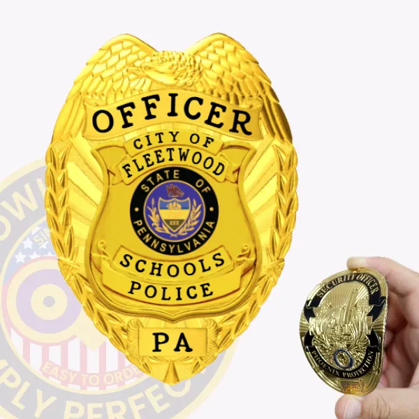 A custom flex badge in gold displaying the title "OFFICER" at the top, with "CITY OF FLEETWOOD" above a circular emblem representing the state of Pennsylvania. The badge features "SCHOOLS POLICE" prominently in the center and the abbreviation "PA" at the bottom. In the foreground, a hand holds a smaller gold badge labeled "SECURITY OFFICER," highlighting the differences between the two badges. The gold badge is intricately designed with detailed engravings and a polished finish, emphasizing its official appearance and importance.