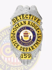 Ocean Ridge police detective custom silver metal badge featuring gold panels, shaped like a shield with an eagle embossed at the top, black text "DETECTIVE" on a gold banner at the top, "OCEAN RIDGE POLICE DEPARTMENT" around the central Colorado state seal, and badge number "159" on a gold panel at the base, equipped with a safety pin.