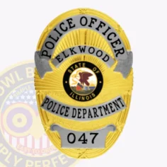 A custom metal badge in gold with silver panels and safety pin attachment, prominently featuring "police officer" at the top. Below, "elkwood" is displayed, accompanied by the state seal of illinois at the center. The badge's bright gold finish is accented by silver detailing, creating a striking and professional appearance.