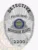 A visually appealing custom metal badge in silver with a safety pin attachment, featuring "2200" at the bottom to indicate a specific badge number. The text "POLICE DEPT." arches gracefully above the state seal of Vermont, surrounded by ornamental designs that enhance its sophistication.