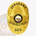 Official Oval Shield with Building Center, Sunburst Background, 3 Text panels, Ribbon Edge Badge view 1