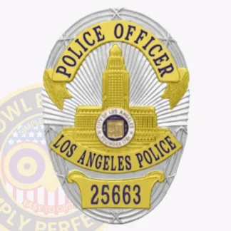 A detailed image of a custom metal LAPD badge in silver color with gold panels. The badge prominently features the words "POLICE OFFICER" at the top and "LOS ANGELES POLICE" arching below, along with the badge number 25663 at the bottom. The center showcases a depiction of a historic building, symbolizing the City of Los Angeles. The intricate design highlights the contrasting gold panels, creating a striking visual representation of authority and service.