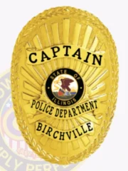 This stylish custom metal badge in gold with safety pin attachment highlights "CAPTAIN" at the top in large black letters. Below, "POLICE DEPARTMENT" is prominently displayed, complemented by "BIRCHVILLE" at the base. The badge features the state seal of Illinois in the center, enhancing its professional look.