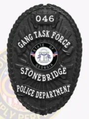 This eye-catching custom metal badge in black with safety pin attachment showcases "GANG TASK FORCE" at the top in large white letters against a sleek black backdrop. Below it, "STONEBRIDGE" is clearly visible under the central emblem of the Georgia state seal, while "POLICE DEPARTMENT" is prominently displayed at the base, and "046" is featured at the top for added detail.