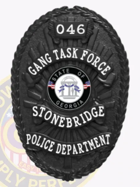 This eye-catching custom metal badge in black with safety pin attachment showcases "GANG TASK FORCE" at the top in large white letters against a sleek black backdrop. Below it, "STONEBRIDGE" is clearly visible under the central emblem of the Georgia state seal, while "POLICE DEPARTMENT" is prominently displayed at the base, and "046" is featured at the top for added detail.