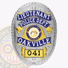 This custom metal badge in silver with reverse enamel blue accents and with safety pin attachment prominently displays "lieutenant" at the top in bold white letters against a striking blue background. Below, "police dept. " is clearly visible, leading into "oakville" in vibrant blue. The central emblem showcases the state seal of georgia, while "041" is highlighted in a black box at the bottom.