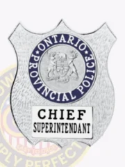 Ontario Provincial Police silver metal shield badge with the provincial emblem inside a blue ring at the top and “Chief Superintendant” printed in black on a white plate below, designed with safety pin attachment.