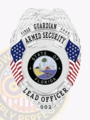 This image presents a silver custom metal badge for armed security, highlighted by the eagle design at the top. "Guardian Armed Security" is inscribed prominently above the Florida state seal, which is encircled by red and white stripes. The badge reads "Armed Security Lead Officer 002" at the base, complemented by a reliable safety pin attachment for easy wear.