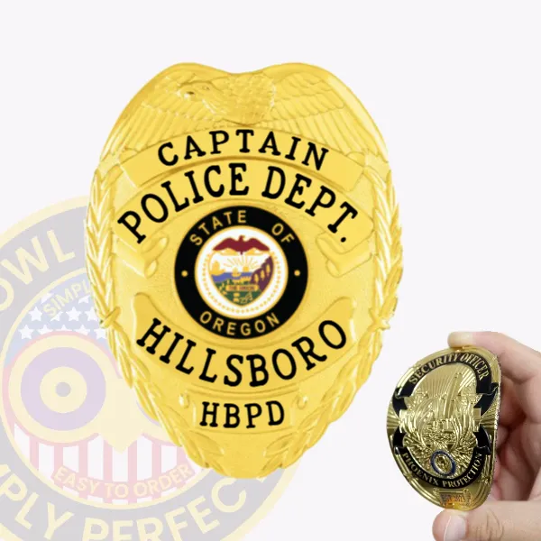 Bright gold flex badge for Hillsboro Police Captain with a large eagle spread atop, gold banners with clear black lettering reading "CAPTAIN," "POLICE DEPT.," "HILLSBORO," and "HBPD," surrounding the detailed Oregon state seal in the center, secured by a velcro attachment.