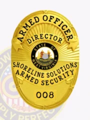 Showcasing a polished gold finish, this custom metal badge for armed security features the title "ARMED OFFICER" prominently at the top and "DIRECTOR" directly underneath. The center displays the state of West Virginia's emblem, encircled by "SHORELINE SOLUTIONS ARMED SECURITY" and the badge number "008." A safety pin attachment ensures secure placement on uniforms.