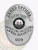 This custom metal badge for armed security features a polished silver finish in an oval shape. At the top, "ARMED OFFICER" is prominently displayed in bold lettering, with the title "SUPERVISOR" just below it in a slightly smaller font. The center showcases the state seal of West Virginia, encircled by the words "SHORELINE SOLUTIONS ARMED SECURITY." The badge also includes the number "009" at the bottom and is equipped with a safety pin attachment for secure wear.