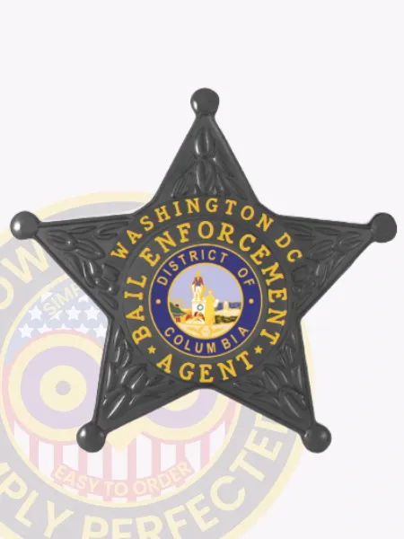 Metal bail enforcement agent badge in black shaped as a five-point star, detailed with embossed patterns, a center circle displaying the District of Columbia seal, and gold lettering "Washington DC Bail Enforcement Agent," secured by a safety pin.