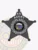Black metal 5-point star badge designed for Alaska fugitive recovery agents, displaying "AK AGENT" at the top and "FUGITIVE RECOVERY" in bold white letters encircling the official Alaska state emblem, along with a numeric code, secured with a safety pin fastener.