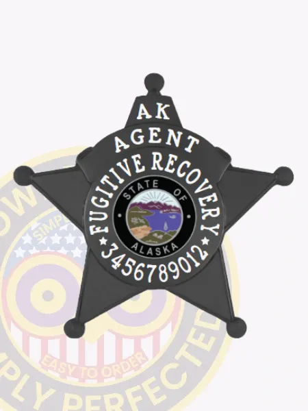Black metal 5-point star badge designed for Alaska fugitive recovery agents, displaying "AK AGENT" at the top and "FUGITIVE RECOVERY" in bold white letters encircling the official Alaska state emblem, along with a numeric code, secured with a safety pin fastener.