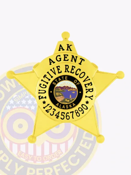 Polished gold metal badge in the shape of a 5-point star for Alaska fugitive recovery agents, featuring black text "AK AGENT FUGITIVE RECOVERY" encircling the colorful state seal and a series of numbers at the bottom, equipped with a safety pin for easy wear.