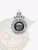 Silver metal 5-point star badge for fugitive recovery agents in Alaska showing "AK AGENT FUGITIVE RECOVERY" in black letters surrounding the official Alaska state emblem, with a numbered code beneath, and attached with a safety pin.