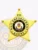 Custom metal badge in gold shaped like a 5 point star for bail enforcement agents, featuring a central circular emblem with the Colorado state seal, black text reading "Bail Enforcement Agent," and "CO" on the top star tip, fastened with safety pin attachment.
