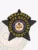 Arkansas fugitive recovery agent badge in black metal shaped as a 5-point star, featuring bright yellow text "ARKANSAS FUGITIVE RECOVERY AGENT" surrounding the detailed state seal, with a safety pin attachment for easy wear.
