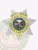 A custom metal badge for deputy sheriffs, this design showcases a stunning silver 7-point star with gold panels. The inscription "GOLDEN VALLEY SHERIFF'S DEPARTMENT" encircles the central emblem, while "DEPUTY SHERIFF" is displayed at the top. A safety pin attachment allows for easy and secure fastening.