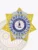 Detailed gold 6 pointed star metal badge with silver panel accents and a circular banner displaying “VA,” “BAIL ENFORCEMENT AGENT,” and “USA,” made for bail enforcement agents with a safety pin fastener.