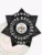 Custom black metal 7 point star badge highlighted by intricate black embossing, containing a central round seal labeled "Hawaii Fugitive Recovery Agent" around the official State of Hawaii symbol, with "FRA" on a banner below, finished with a safety pin fastener for fugitive recovery agents in Hawai'i.