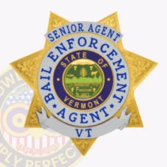 Custom gold 6 pointed star metal badge with detailed silver panels, featuring a banner at the top that reads “senior agent” and a circular blue and white ring around the center with the text “bail enforcement agent vt. ”