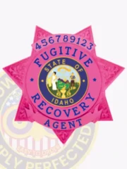 Pink BCAM 7 point star metal badge with detailed raised designs on every point, showing a central blue and gold Idaho state seal encircled by the words "Fugitive Recovery Agent" in blue letters, along with the numeric ID "456789123" above, finished with a safety pin fastener for fugitive recovery agents in Idaho.