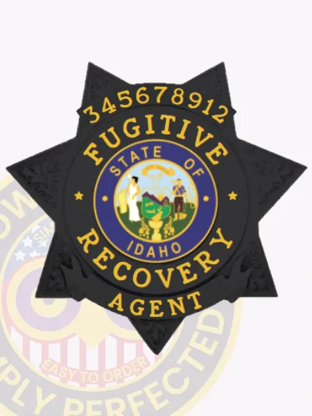 Custom black metal 7 point star badge featuring embossed ornamental accents on each point, displaying a round seal marked "State of Idaho" surrounded by yellow "Fugitive Recovery Agent" text, and a number "345678912" on a banner at the top, equipped with a safety pin attachment for fugitive recovery agents in Idaho.
