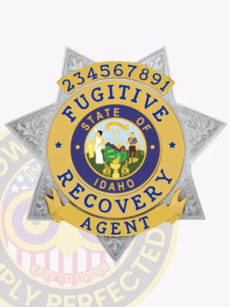 Detailed silver 7 point star metal badge with raised floral and scrollwork embossing, containing gold panels with bold blue text that reads "Fugitive Recovery Agent Idaho," surrounding the colorful Idaho state seal, plus the number "234567891" on the upper banner, crafted as a custom metal badge with safety pin attachment for fugitive recovery agents in Idaho.