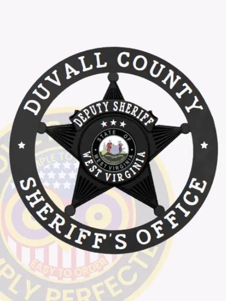 A bold black custom metal badge for deputy sheriffs, featuring a star shape at the center. The top inscription reads "DEPUTY SHERIFF," while the circular outer edge states "DUVALL COUNTY SHERIFF'S OFFICE." In the center, the badge highlights “STATE OF WEST VIRGINIA” along with a detailed emblem. This badge includes a safety pin attachment for secure wear.