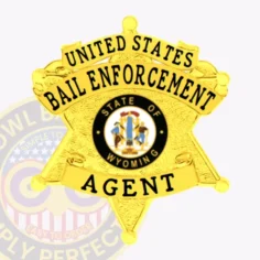 Polished gold six-point star metal badge designed for bail enforcement agents, featuring two curved banners with black lettering “united states bail enforcement agent,” surrounding the detailed wyoming state seal, finished with a safety pin on the back.