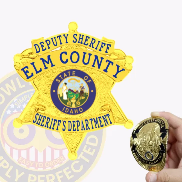 A shiny gold custom flex badge for deputy sheriffs, prominently displaying the text "DEPUTY SHERIFF ELM COUNTY" arched at the top. In the center, a circular emblem showcases the "STATE OF IDAHO" surrounded by a vibrant blue border. Below, the words "SHERIFF'S DEPARTMENT" are boldly printed in gold. The badge features a velcro attachment for easy wear.