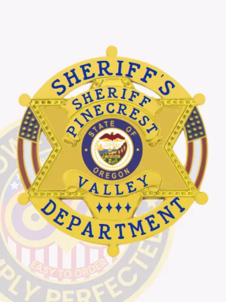 A polished custom 6 point star in a circle banner metal badge for sheriff departments, shining in a luxurious gold finish. The badge features "SHERIFF'S" at the top, with "PINECREST VALLEY DEPARTMENT" encircling a vibrant emblem showcasing the state of Oregon. Designed with a safety pin attachment, it offers convenient and reliable wearing.