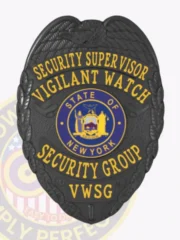 A custom metal badge for a security supervisor, designed in a sleek black finish. The badge prominently displays "SECURITY SUPERVISOR" at the top in bold yellow letters, followed by "VIGILANT WATCH." The central area features a circular emblem representing the state of New York, surrounded by "SECURITY GROUP" and "VWSG." The badge includes decorative eagle wings and is secured with a sturdy safety pin attachment for reliable wear.