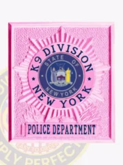 NYPD custom square sunburst badge designed in eye-catching BCAM pink for the K9 Division. The bold black text "K9 DIVISION" stands out prominently at the top, framing a detailed state emblem in the center. "NEW YORK POLICE DEPARTMENT" is elegantly displayed beneath, enhancing its significance. This badge includes a practical safety pin attachment for easy fastening.