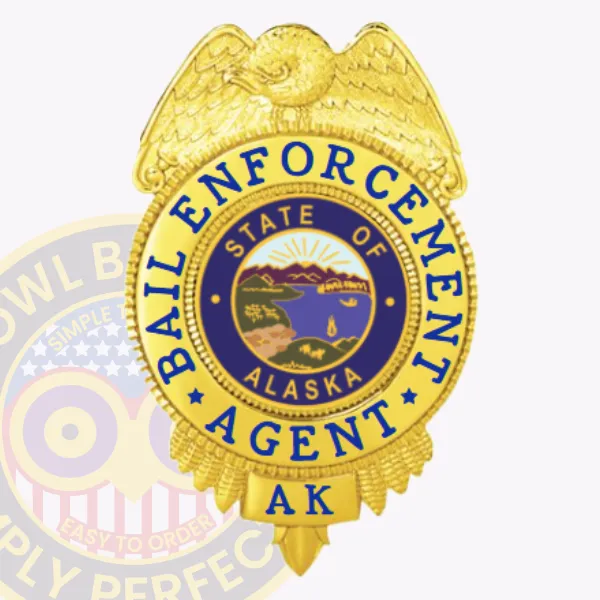 Bail enforcement agent badge made of polished gold metal with a detailed gold eagle perched atop, blue text "Bail Enforcement Agent" encircling the Alaska state seal, and "AK" at the base, attached via a safety pin for secure wear.
