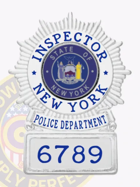 NYPD custom sunburst shield badge designed in sleek silver for the rank of inspector. The bold blue text "INSPECTOR" stands out prominently at the top, surrounding a detailed state emblem in the center. "NEW YORK POLICE DEPARTMENT" curves gracefully beneath, with the badge number "6789" prominently featured at the bottom. This badge includes a practical safety pin attachment for easy and secure fastening.