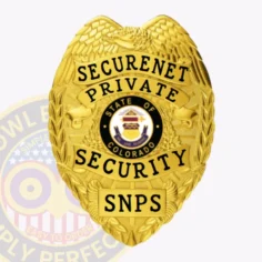 A radiant gold badge shaped like a shield, featuring intricate designs that enhance its luxurious appearance. The words "securenet private security" are boldly displayed at the top in black lettering, while a central emblem showcases "state of colorado" surrounded by decorative elements. Below this, the letters "snps" stand out prominently. This custom metal badge for private security in gold with safety pin attachment combines elegance and authority.