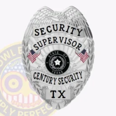 A custom metal badge for a security supervisor, designed in a sleek silver finish. The badge prominently displays "security supervisor" in bold black lettering at the top. Below, "century security" and "tx" are elegantly arranged around a central emblem representing the state of texas. The design features intricate details, including eagle wings and small flags, and is secured with a sturdy safety pin attachment for reliable wear.