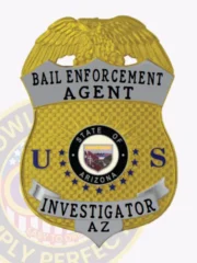 Bail enforcement agent shield badge made of gold metal with a gold eagle at the top, silver panels inscribed with "Bail Enforcement Agent" and "Investigator AZ," a central Arizona state seal, and blue letters "U" and "S" on either side, fastened by a safety pin.