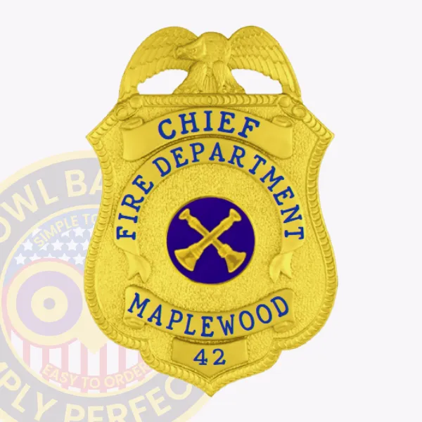 Custom gold eagle-top metal badge for Maplewood Fire Department Chief, displaying blue lettering “CHIEF FIRE DEPARTMENT MAPLEWOOD 42” enveloping a blue circle with crossed axes in the middle, designed for easy wear with safety pin attachment.