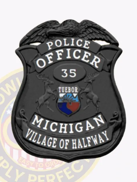 Village of Halfway Police Dept. custom black metal badge showing a raised eagle atop a black shield, bold white text "POLICE OFFICER," officer number "35" in the oval center, colorful Michigan state seal framed by two deer, and "MICHIGAN VILLAGE OF HALFWAY" at the base, equipped with a safety pin attachment.