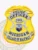 Custom gold eagle top metal badge displaying a gleaming gold shield with a detailed eagle on top, white banners bearing black text "POLICE OFFICER," officer number "192" in the oval center, two silver deer flanking the Michigan state seal in color, and "MICHIGAN VILLAGE OF HALFWAY" on the bottom ribbon, crafted for police officers with safety pin attachment.