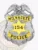 Custom Milwaukee Police Dept. badge in silver metal featuring an eagle on top, gold curved banners with black text MILWAUKEE and POLICE, and a central gold star displaying the number 154, attached with a safety pin.