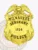 Milwaukee Police Dept. custom gold metal badge for Sergeant featuring a detailed eagle atop the shield shape, gold banners with black text MILWAUKEE, SERGEANT, and POLICE, and a central gold star displaying 1824, attached with a safety pin.