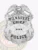 Milwaukee Police Dept. custom silver metal badge for Chief with an eagle perched above the shield, white banners engraved with MILWAUKEE, CHIEF, and POLICE in black lettering, plus a central silver star displaying four black stars, equipped with a safety pin attachment.