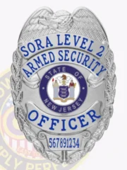 Detailed custom silver metal badge with an eagle at the crest, bright blue text reading SORA LEVEL 2 ARMED SECURITY OFFICER encircling the New Jersey state seal, and a numeric ID plate 567891234 attached with a safety pin.