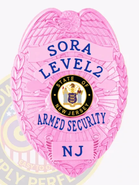 Pink eagle crest metal badge for New Jersey SORA officers, showing blue text SORA LEVEL2 ARMED SECURITY NJ around the state seal, made from flexible material with a safety pin attachment.